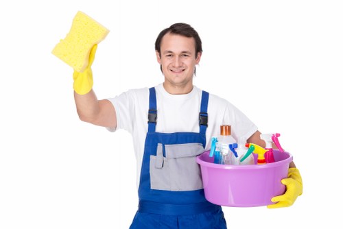 Cleaner maintaining a bright residential communal entrance