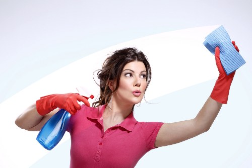 Vacuuming a mattress to remove dust and allergens